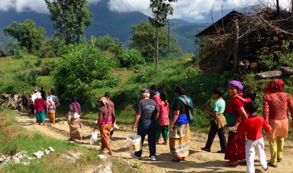 Villagers walking along rural mountain trail
