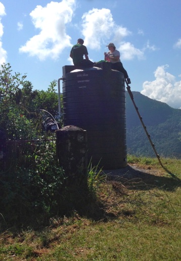 Briggs and  Kyle prepare to clean tank