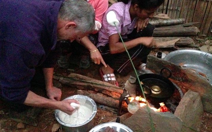 John attempts making sel roti for Tihar