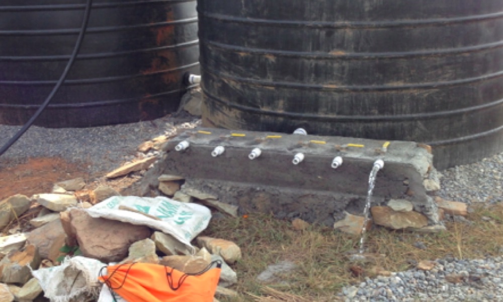 First water flows from hilltop distribution tank manifold